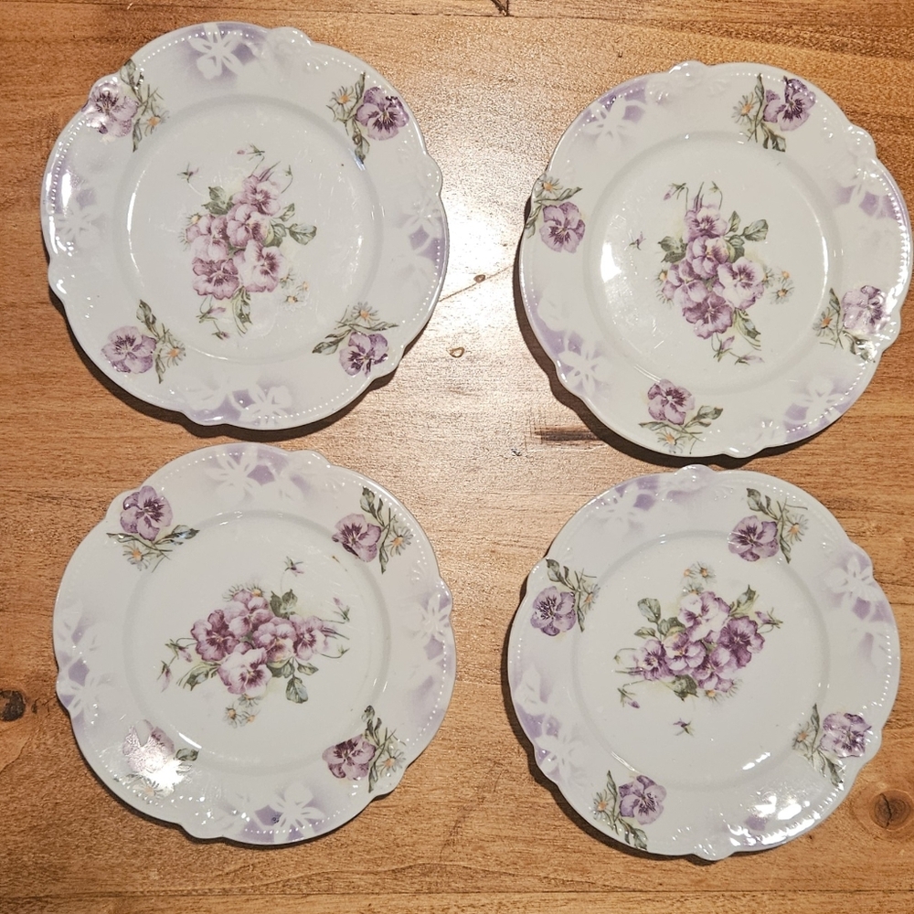 Vintage set of four teacup saucers.